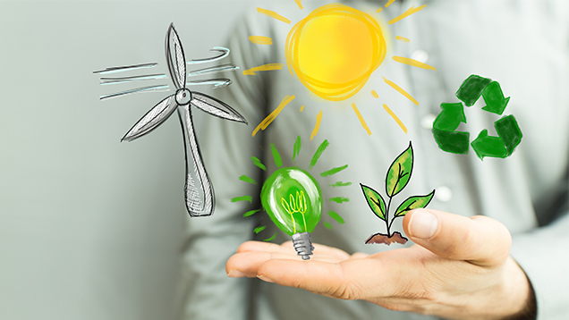 Kuvassa käsi ja uusiutuvan energian symboleita